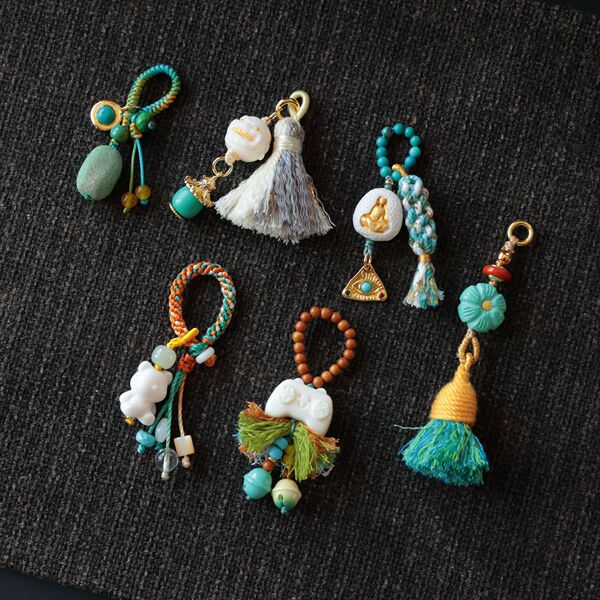 Genuine design pendant with tassels