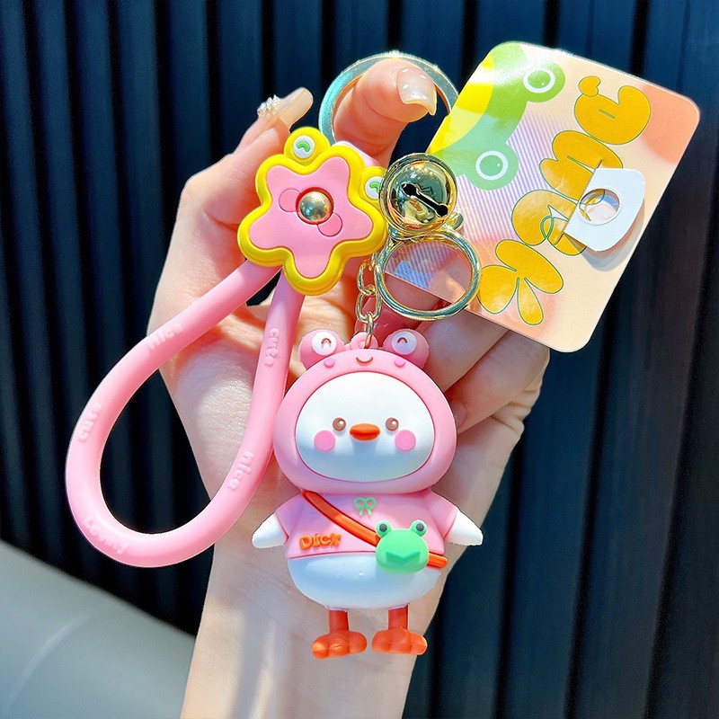 Keychain dinosaurio auténtico lindo bolso colgante de goma blanda llavero de automóvil muñeca pequeña máquina de regalos al por mayor image 17