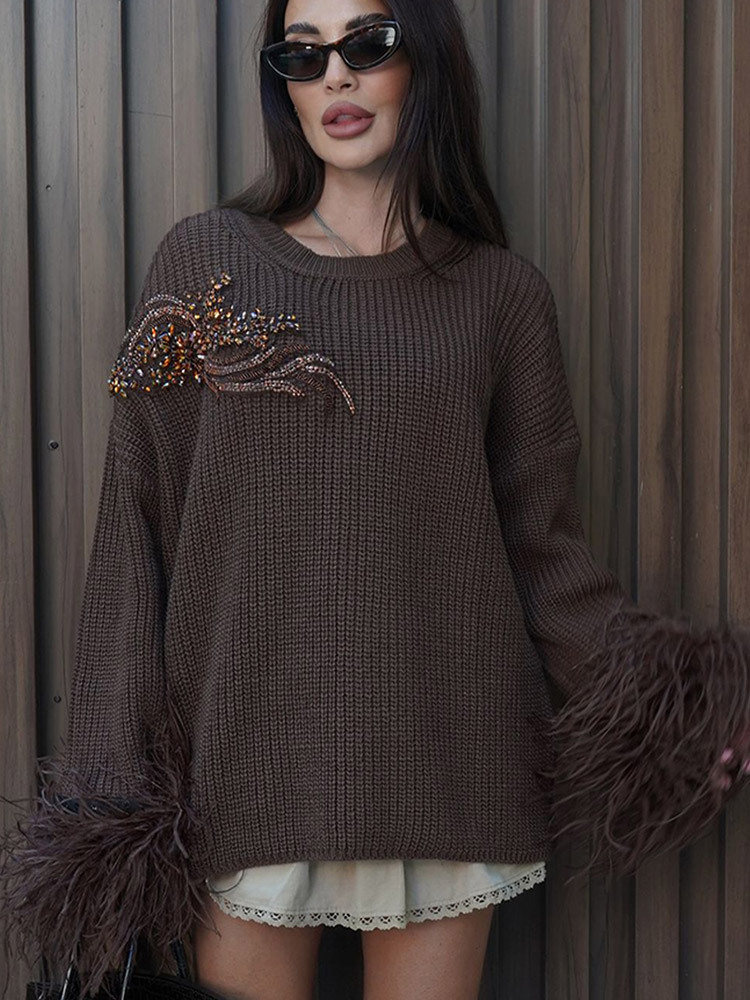 Diseño de moda de bordado de color sólido con adornos de lana, manga de empalme suéter suelto para mujeres 2025, otoño y invierno nuevo estilo transfronterizo Europa y América