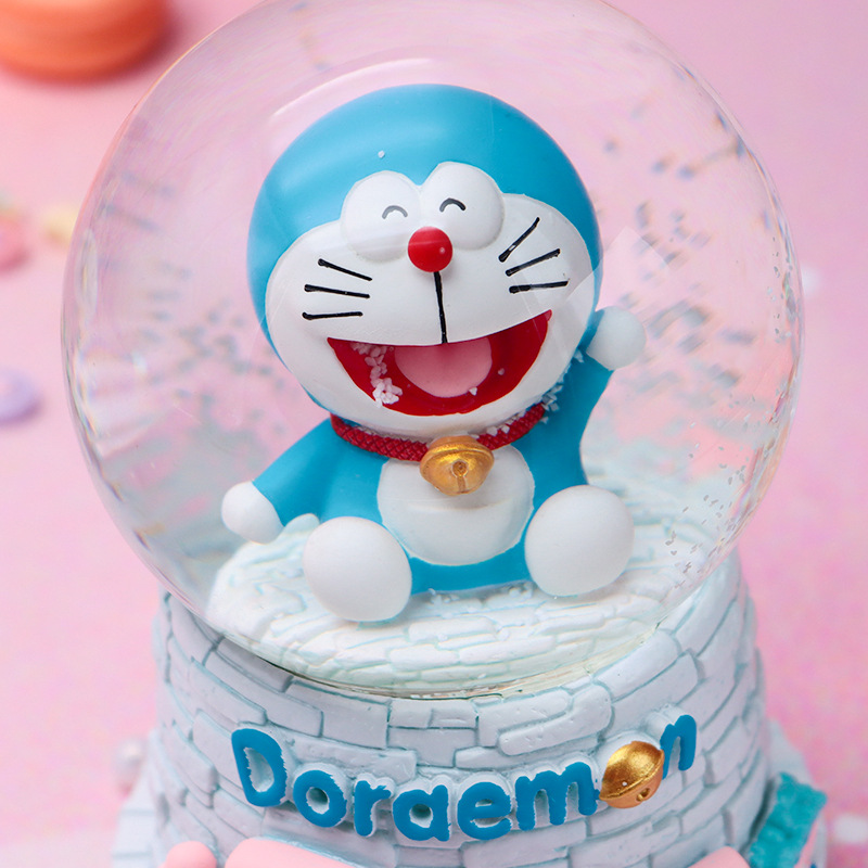 Linda campana tren azul gordo bola de cristal caja de música para niños y compañeros de clase regalo caja de música de nieve brillante