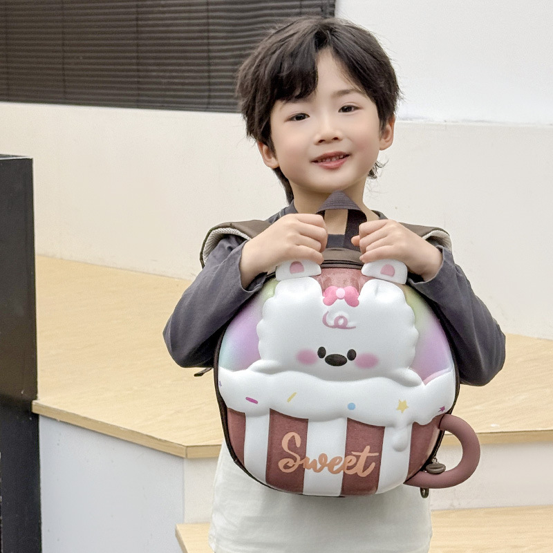 Jardín de infantes bebé mochila de cáscara de huevo dibujos animados lindos tazas de té de leche mochila para niños y niñas nueva mochila infantil transfronteriza