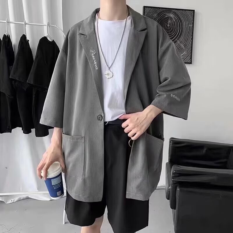 カジュアルスーツの男性の夏の薄いデザイン感の上着のデザイン感は街のデブの大きいサイズの7分の袖のコートのスーツを揚げます。