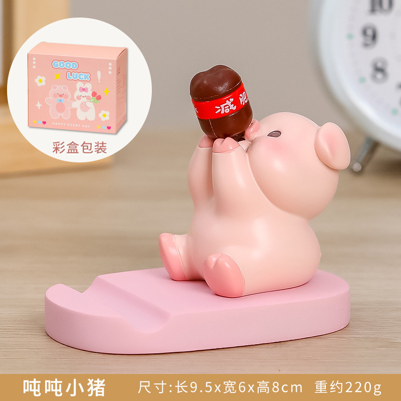 汗を流して携帯のスタンドのデスクトップの置物のステーションの情緒が安定しています。|undefined
