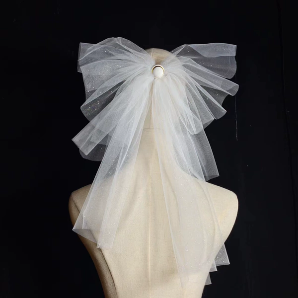 Gold spray veil with white button bow