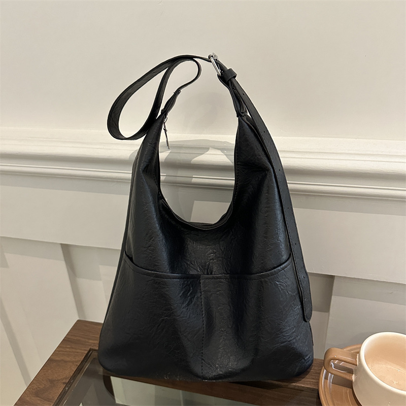 Bolso de mujer 2024, nuevo otoño y invierno de alta calidad, bolso de brazo de viaje simple, bolso de hombro de gran capacidad para mujeres.