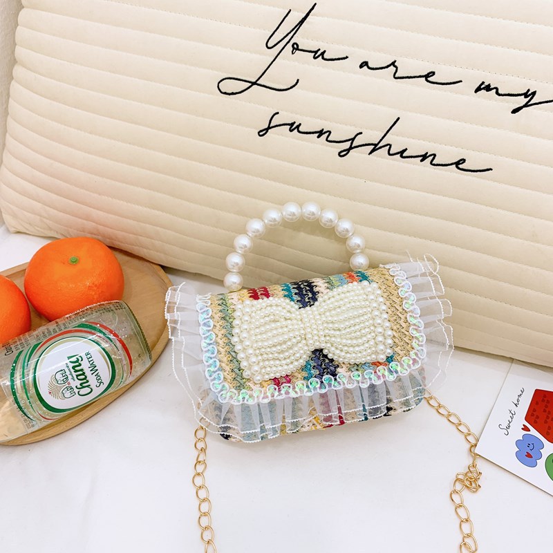 2025 nuevo regalo para niñas para niñas jardín de infantes Día de los niños arco de perla tela de paja bolso de hombro