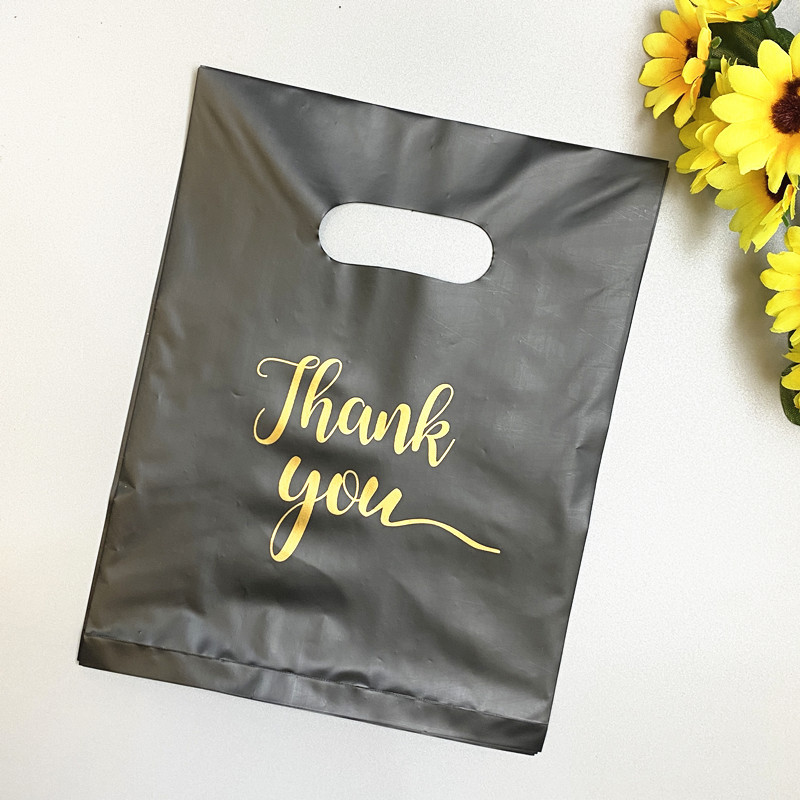 En stock bolsillo plano de cuatro dedos bolsa de plástico portátil Negro Bolsa de ropa bolsa de embalaje de regalo de espesor medio transfronterizo al por mayor