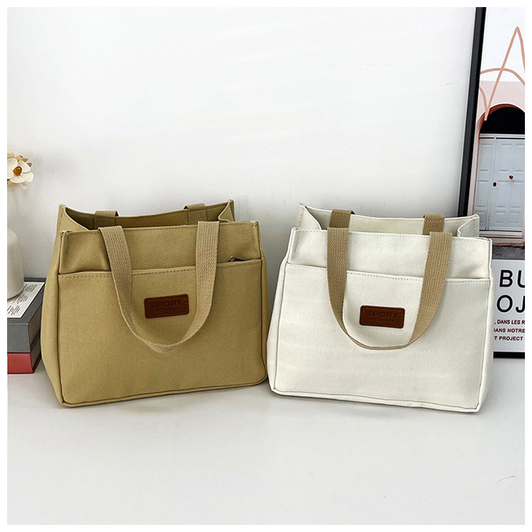 New wholesale fashionable and high-quality canvas handbag, simple and portable, easy to carry for going out, versatile lunch box and bento bag undefined