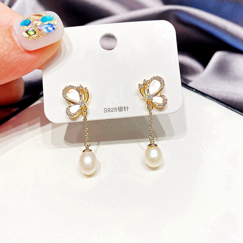 Nihaojewelry Korean Style Butterfly Pearl Tassel Copper Earrings Wholesale Jewelry display picture 1