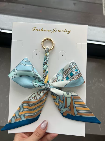 Sky blue bow pendant