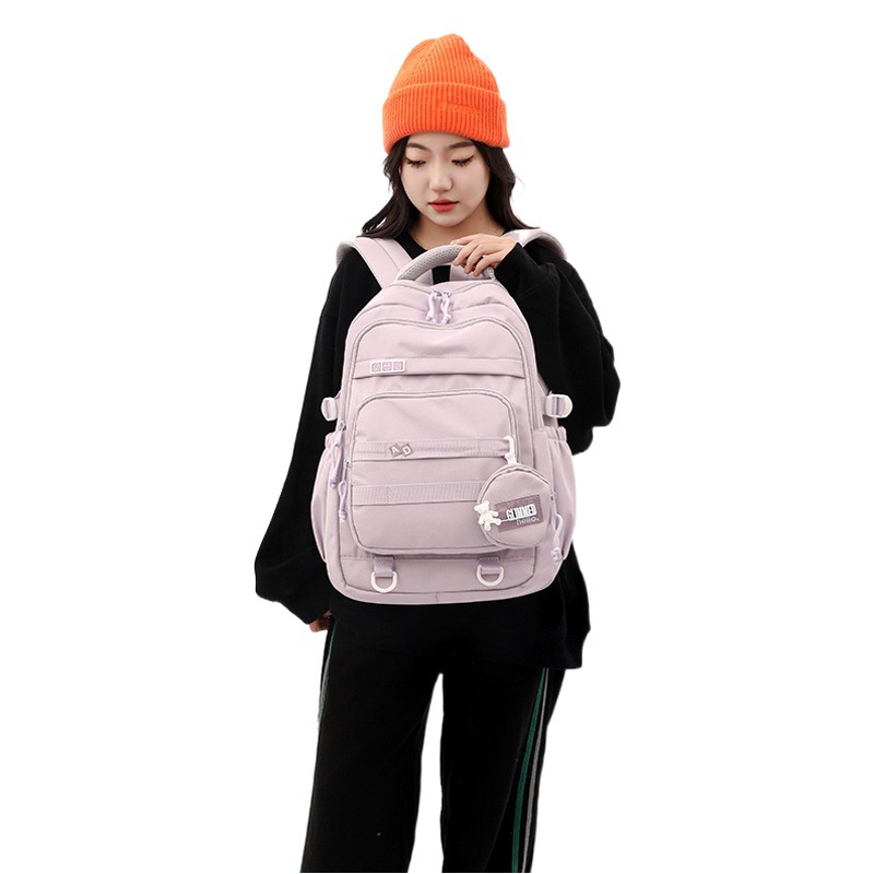 Nuevo bolso de escuela primaria de nailon transfronterizo, mochila reductora de carga, estudiante de secundaria masculino, mochila de moda de gran capacidad al por mayor