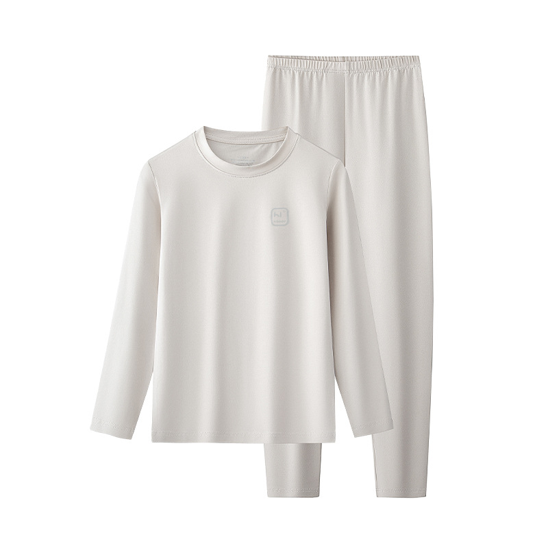 Conjunto de pantalones y tops térmicos finos de manga larga para niños y niñas de otoño e invierno de algodón modal, adecuado para salir o como pijama, color sólido, en stock.