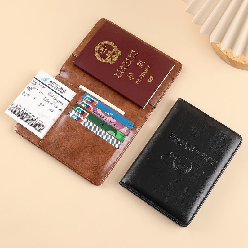 La nueva cubierta protectora de pasaporte retro de gama alta RFID antirrobo pasaporte pasaporte bolsa de identificación masculina billetera tarjeta antimagnética