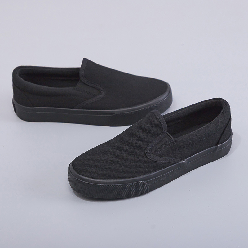 2025 zapatos de lona negros zapatos blancos perezosos un pedazo de primavera coreana para hombres y mujeres zapatos elásticos de estudiantes