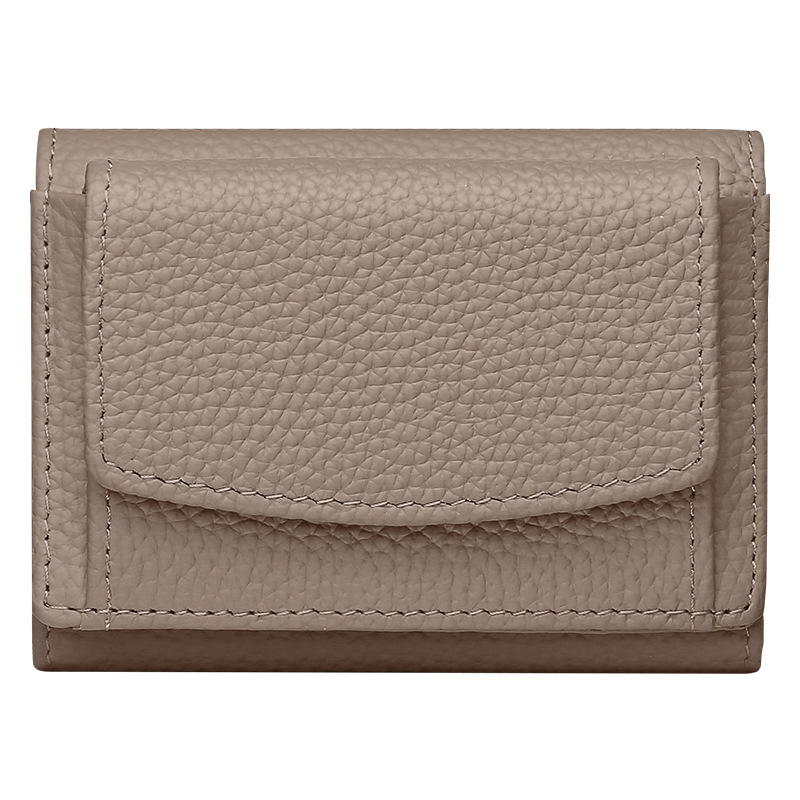 Comercio exterior nueva primera capa de cuero pequeño bolso de monedas de cuero real bolso de monedas de estilo japonés 2 plegable bolso corto de mujeres venta caliente