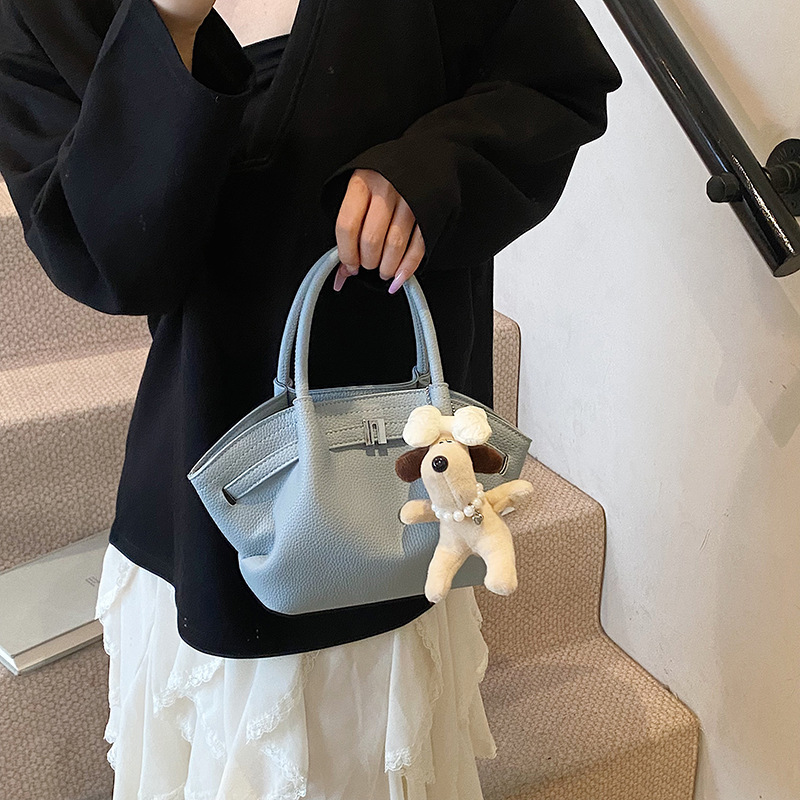 Bolso de cubo de estilo explosivo de moda para mujer, nuevo bolso de hombro de estilo occidental de todo fósforo 2025, bolso de mensajero súper caliente con pliegues de moda