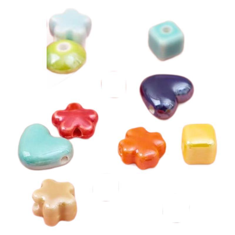 Cerámica de color simple perlada cara de pez cinco pétalos perlas de flores perlas sueltas diy accesorios de decoración de brazalete de cuentas hechas a mano