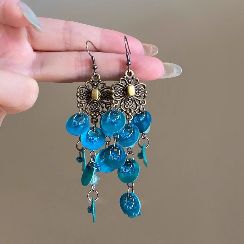 Pendientes de borla de concha geométrica redonda, estilo de vacaciones junto al mar, gancho para la oreja, pendientes de todo fósforo de moda, sentido de clase alta de nicho