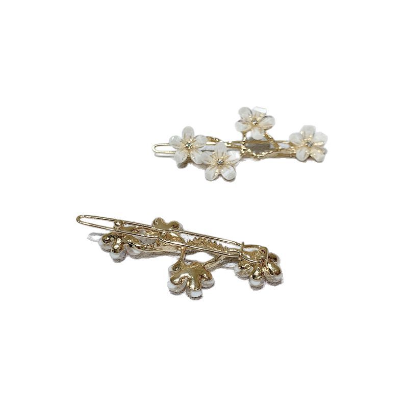 Elegante haarspeld met kattenoogsteen en bloemendesign_voghion.com