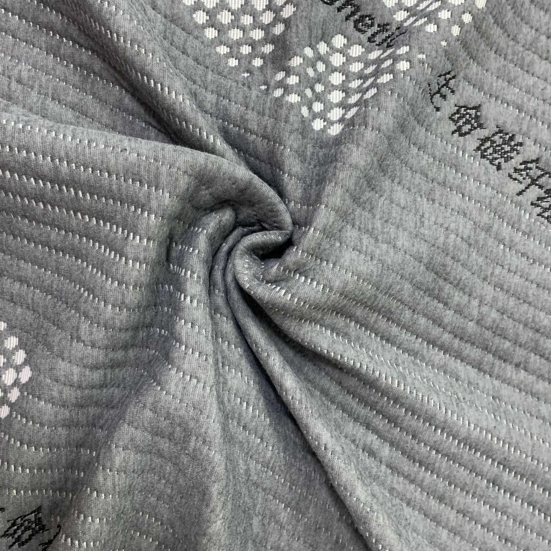 Los fabricantes suministran 180g de tela de colchón gris cáñamo con tela funcional de colchón jacquard de punto de fibra magnética de vida