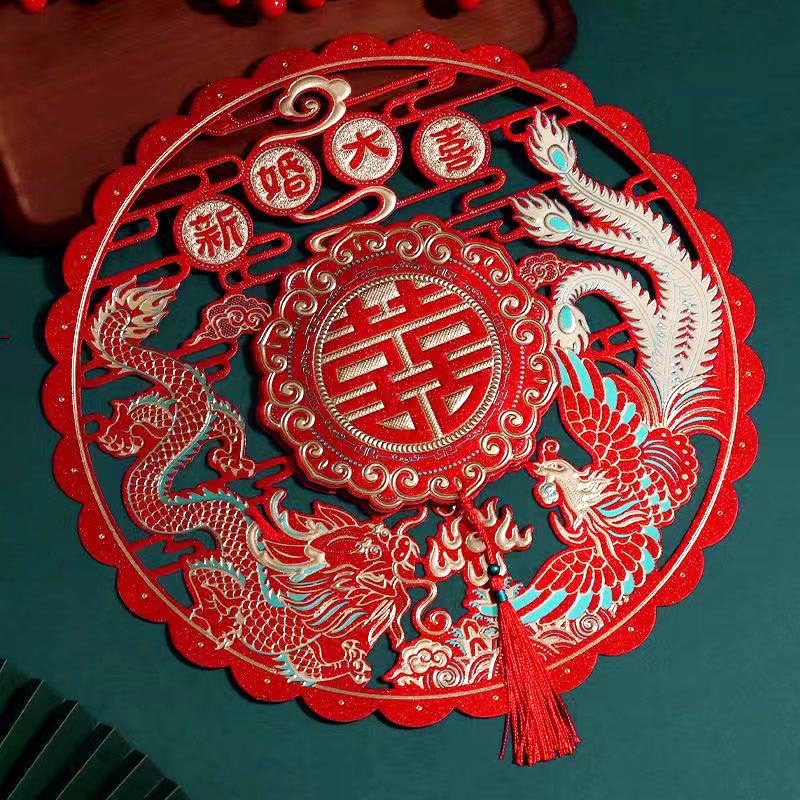 Wedding couplet with golden dragon and phoenix is pasted on the door of the wedding hall. The groom and bride decorate the special room door for the wedding house decoration 