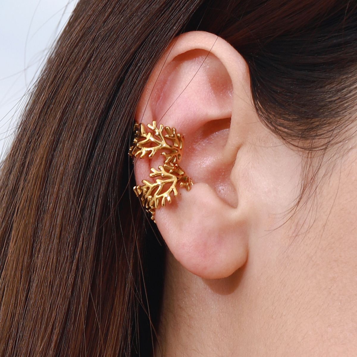 Wanxing moderno europeo y americano minimalista rama brillante clip de oreja abierto hueco Pendientes de acero inoxidable de todo fósforo transfronterizo que no se desvanece