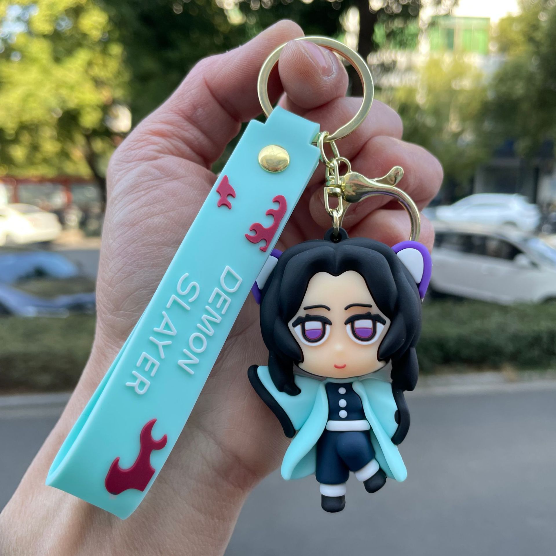 鬼滅の刃の鍵は自動車のキーチェーンの漫画の公仔のかばんのペンダントの子供機の小さい贈り物の卸売りを掛けます。