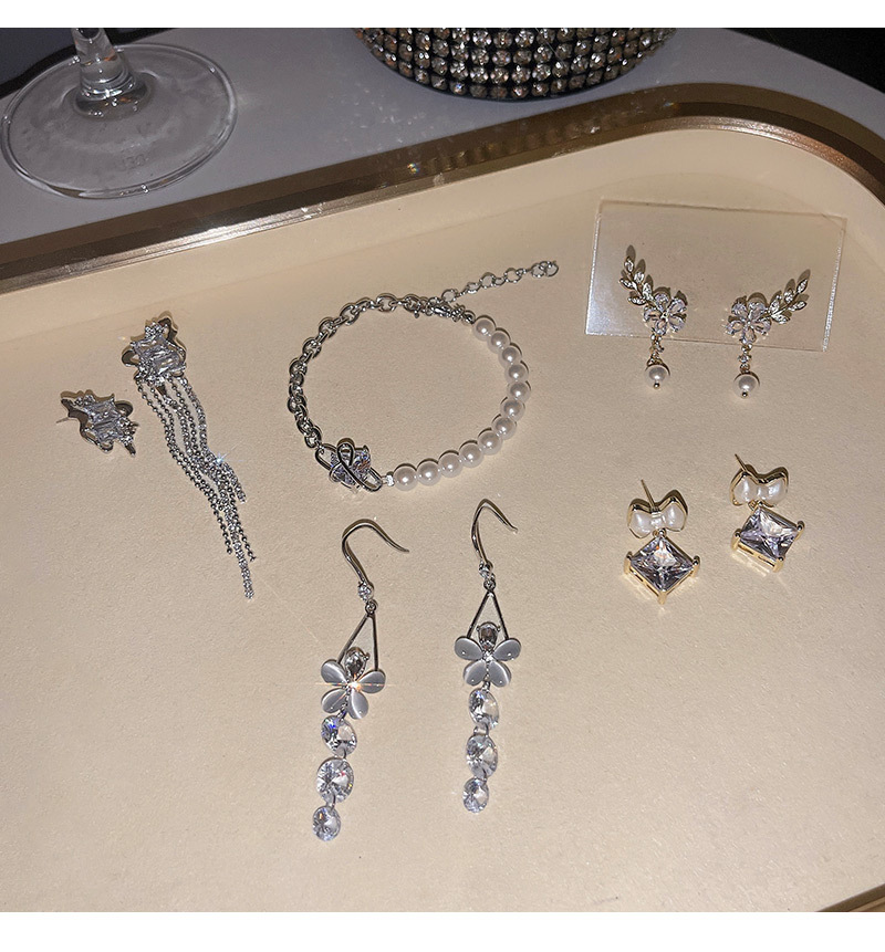 Estilo Simple Nudo De Lazo Cobre Embutido Diamantes De Imitación Pulsera Aretes Collar display picture 1