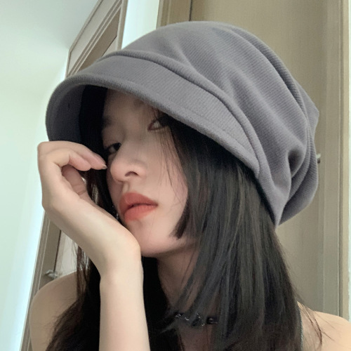 Cold-cap women's winter oversized beanie for autumn and winter—warm, knitted headwear with ear flaps, trendy Japanese-style design that makes faces appear smaller and a social media sensation.