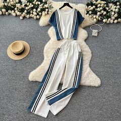 夏のファッションは色のストライプの辺の半袖の上着の腰の高いデニムにぶつかります。