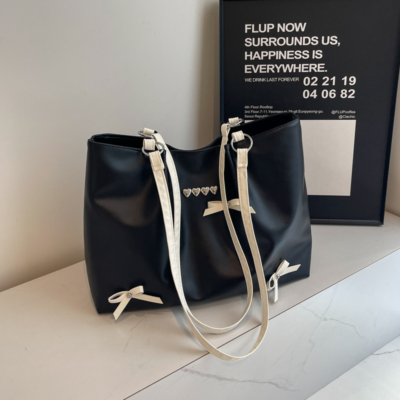 Este año popular bolso de viaje de moda coreana, bolso de hombro de estilo de ballet de mujer, textura alta, arco, bolso de mano.