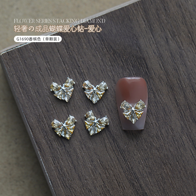 Love bowknot aleación manicura pila de diamantes productos terminados celebridades de Internet nuevas decoraciones de uñas de diamantes de pila súper flash al por mayor