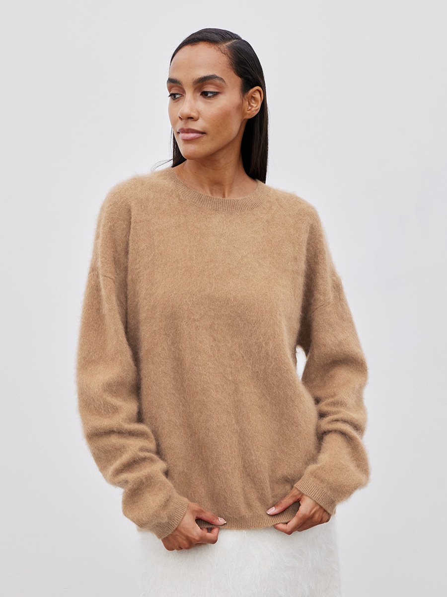 Suéter de cuello redondo transfronterizo Europa y los Estados Unidos 2025 otoño y invierno nuevo estilo simple camisa de punto de color sólido suéter casual suelto