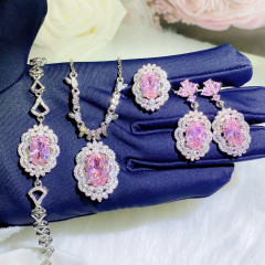 高級感のあるネットの赤い甘さのピンクのドリルのネックレスの豪華な桜の花の花のセットの口の指輪のいっぱいのドリルのイヤリングの色の宝のブレスレット