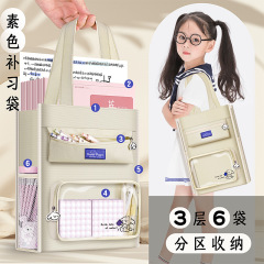 カバ熊キャンバスバッグ女子補習バッグ高校生中学生が本の袋を持っています。