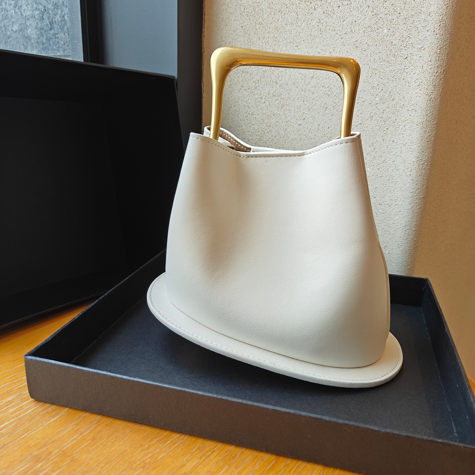 Textura avanzada retro bolso de cubo de madera de cuero genuino 2024 nuevo diseño de nicho irregular bolso casual