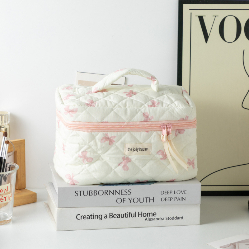 Capacious handheld cute cosmetic bag with bow for traveling