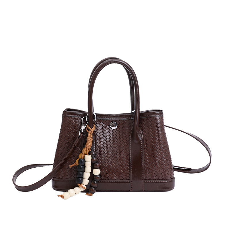 Bolsa de mano de alto nivel transfronterizo trenzada bolsa de cubo de agua para mujeres otoño y invierno 2025 nuevo estilo extranjero bolso de hombro bolso de mochila versátil