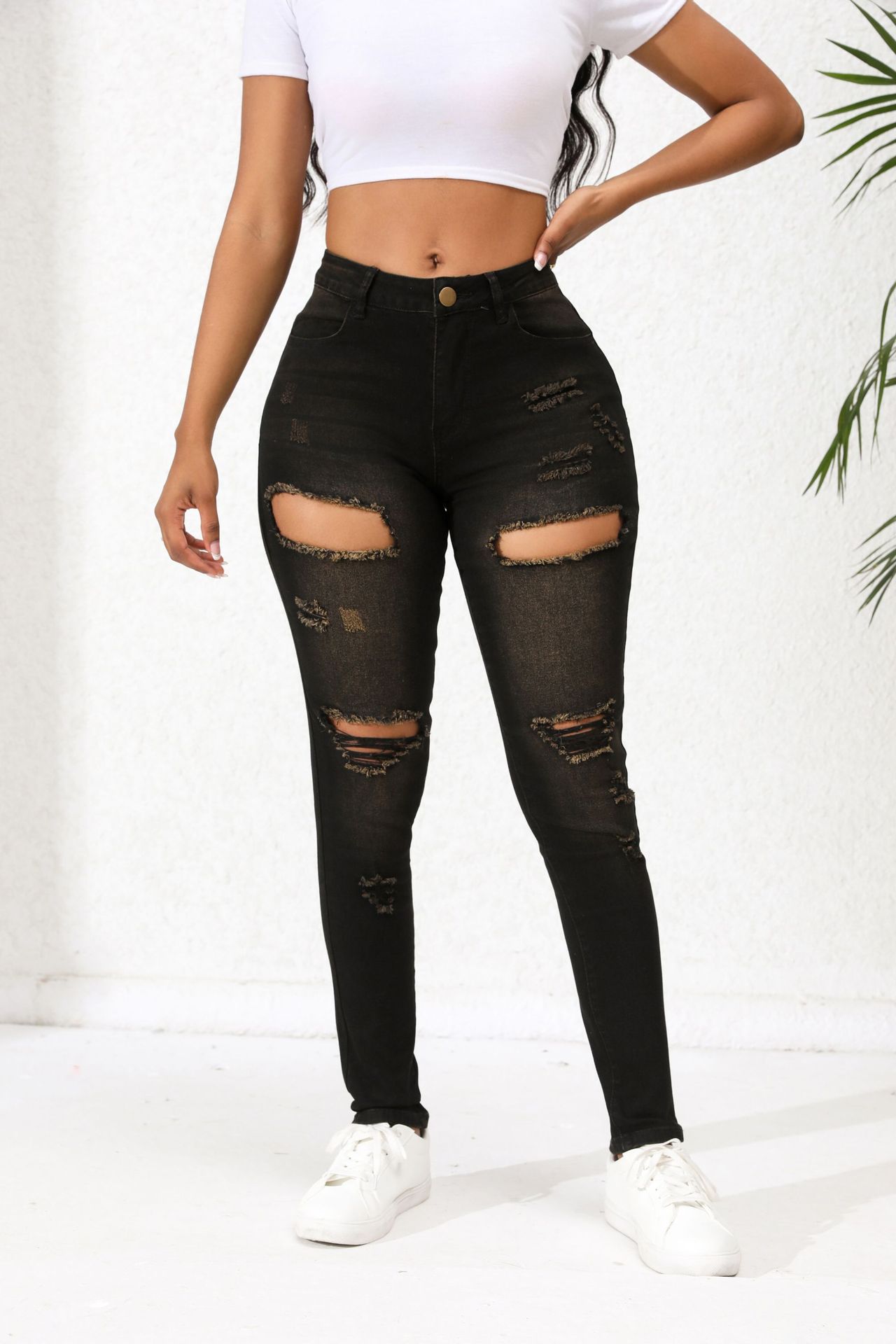 Vaqueros negros rasgados estilo europeo y americano para mujer, pantalones ajustados elásticos de cintura media que hacen que las piernas parezcan más delgadas, en stock para dropshipping.