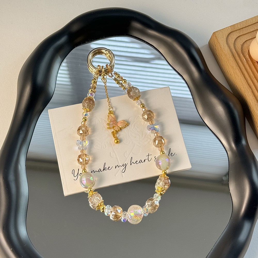 Nuevo estilo chino de alta calidad cadena de teléfonos móviles cristal ligero lujoso viento dorado colgante mariposa frillera corta cuerda de caso de teléfono móvil