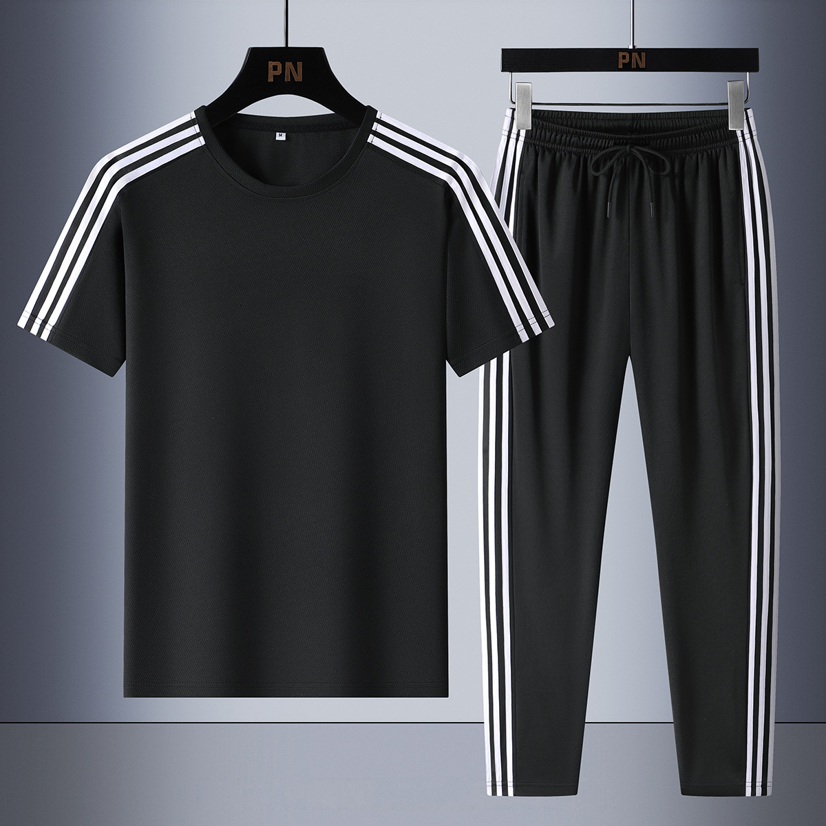 Set de tres barras de verano de moda para hombres, mangas cortas transpirables, pantalones casuales rectos para hombres, set de dos piezas.