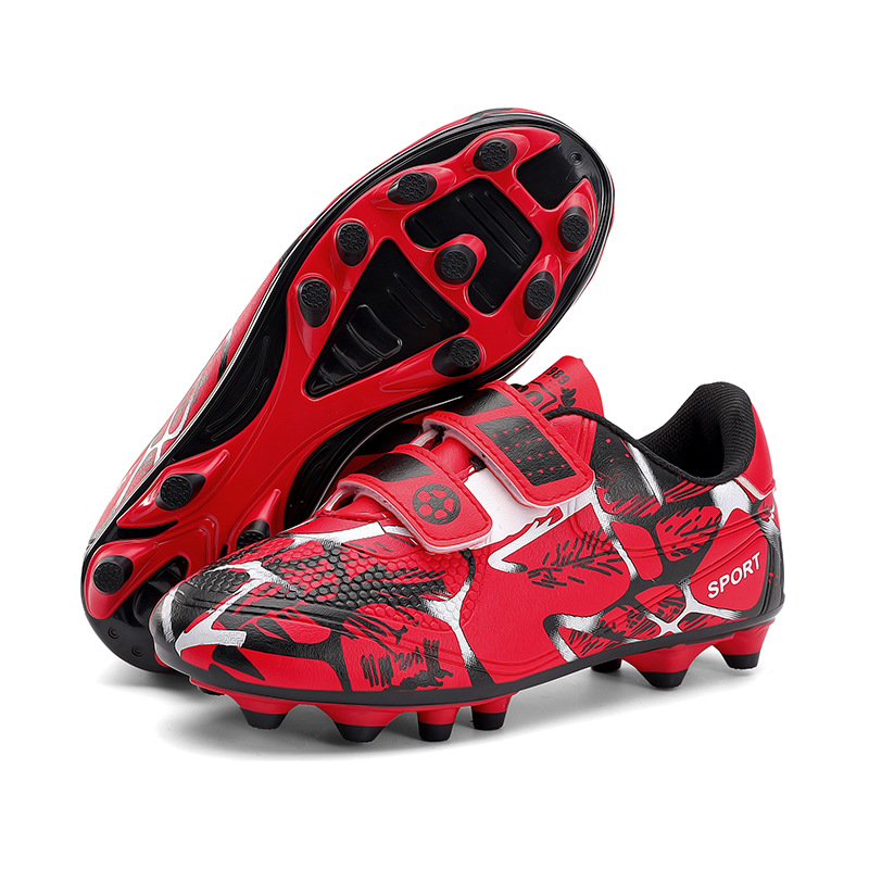 Niños y niñas transfronterizos transpirables cómodos deportes ociosos bajos clavos de clavos de hierba competición zapatos de fútbol de fábrica para niños
