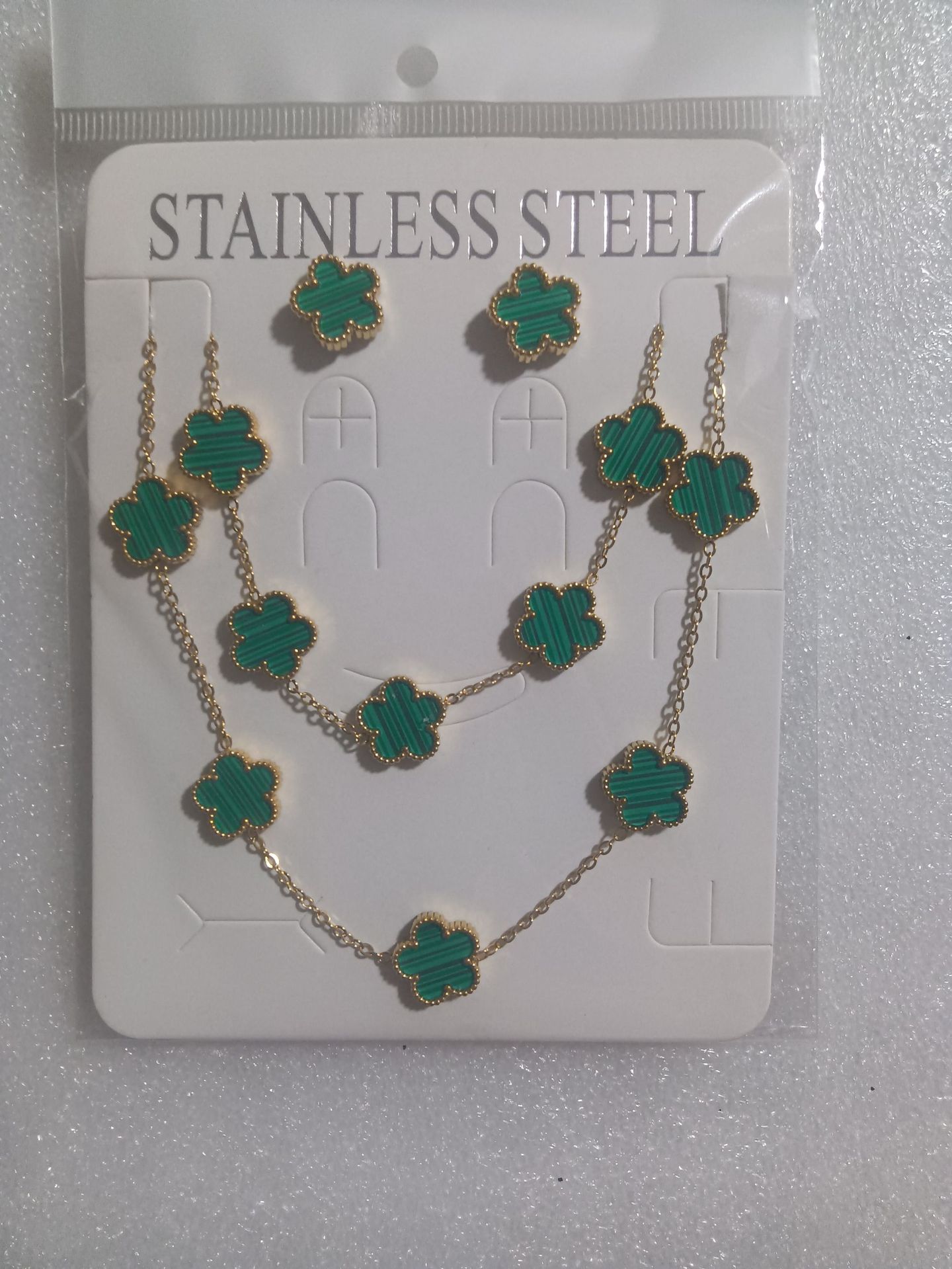 Trébol de cinco hojas de la suerte nuevo estilo transfronterizo pulsera de acero de titanio de doble cara, collar, aretes, moda de nicho de 18K, no se desvanece