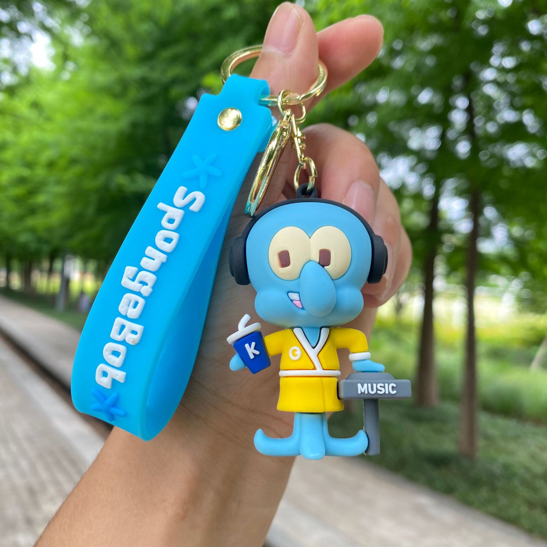 Dibujos animados esponja bebé Paida estrella llavero muñeca colgante coche llavero empuje muñeca máquina regalo al por mayor