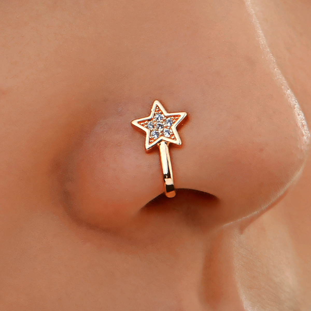 Copper nose piercing with zircon