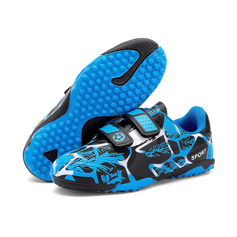 Niños y niñas transfronterizos transpirables cómodos deportes ociosos bajos clavos de clavos de hierba competición zapatos de fútbol de fábrica para niños