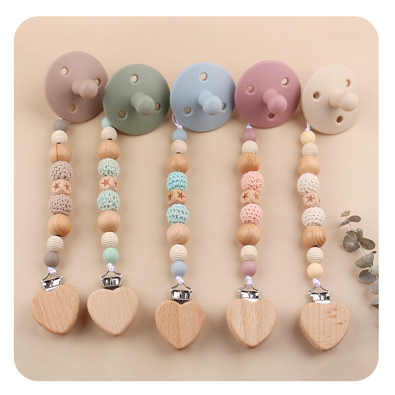 Nuevo bebé dibujos animados penta-planta de hayaja goma de bambú arco correa de cabello calmante tetina cadena set de cinco piezas