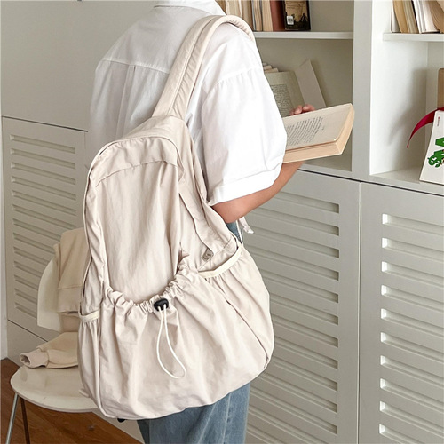 Korean style new college student backpack commuter women's large capacity casual drawstring pleated design nylon backpack for women