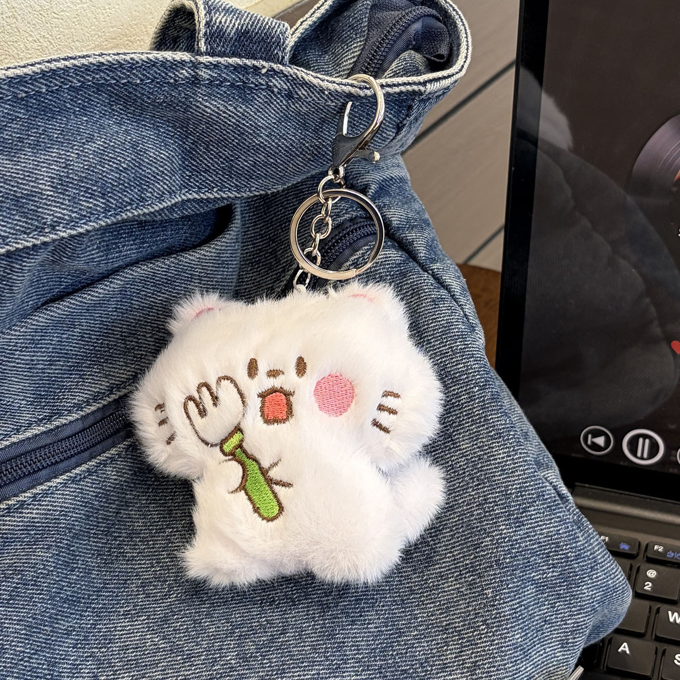 Fork, keychain, kitten