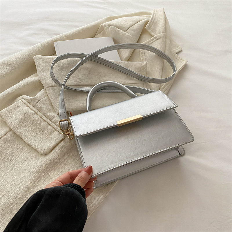 Este año la nueva explosión de bolsos de mujer de alta calidad sensación extranjera bolsos de mano versátiles ligeros de lujo nicho bolsos de hombro de un solo hombro